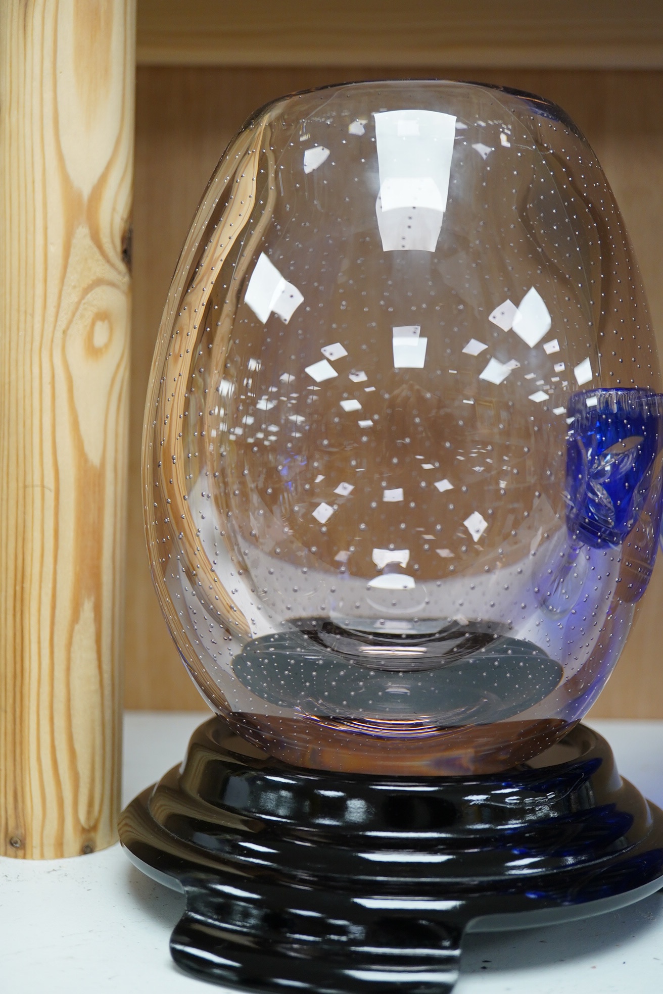 A Whitefriars amethyst ovoid vase on stand and a blue overlaid fruit bowl, vase on stand 20.5cm high. Condition - Whitefriars good, overlaid bowl interior base scratched